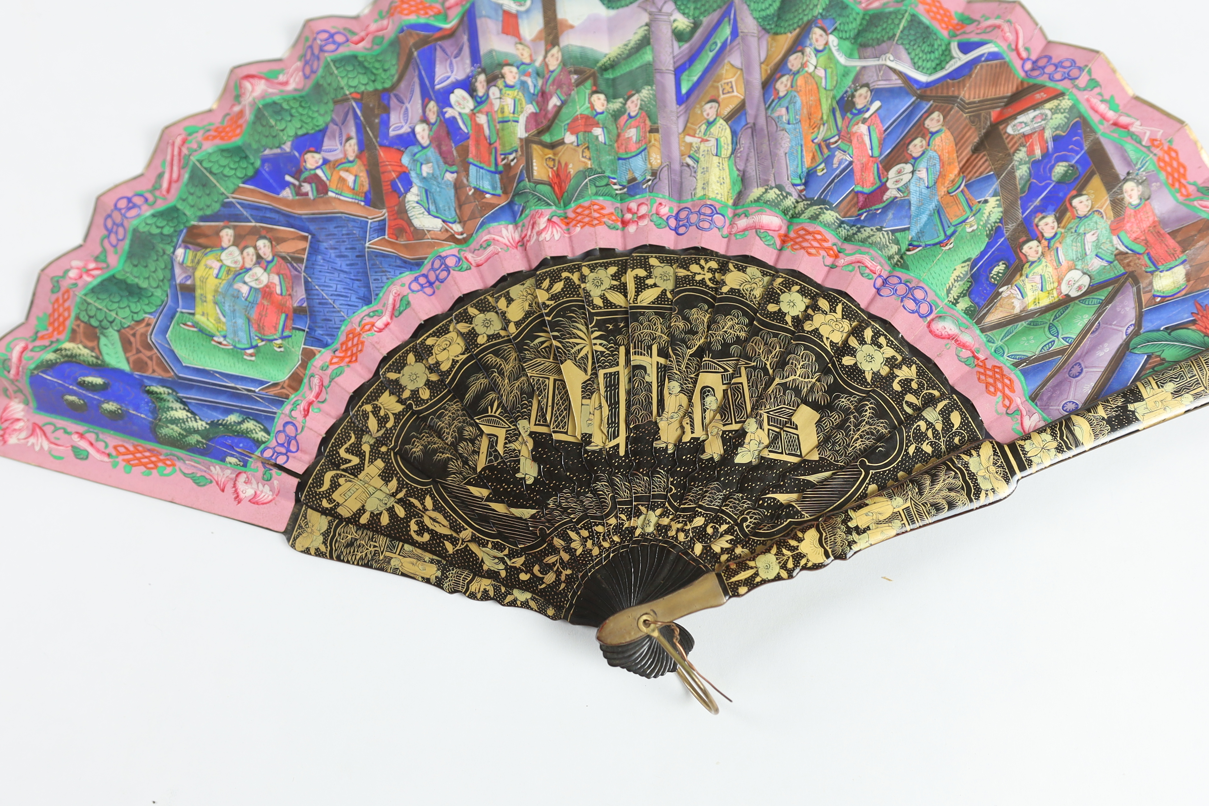 A 19th century Chinese ornately lacquered and hand painted figural leaf fan, the figures on the leaf having painted ivory faces, the back of the fan painted with exotic birds and flowers, CITES Submission reference TJUZX